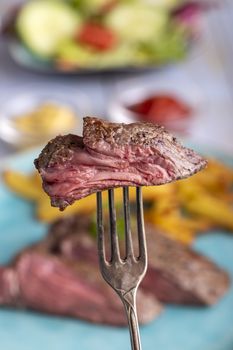 slice of steak on a fork