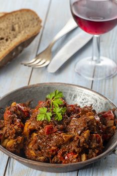 portion of austrian goulash on wood