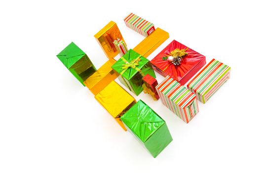 Boxes with xmas presents wrapped. Multi colored purchases. Isolated on white background