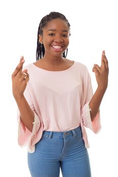 Happy african girl with her fingers crossed isolated on white background