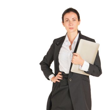 A business woman in a black suit holding on a computer notebook. Portrait on white background with studio light.
