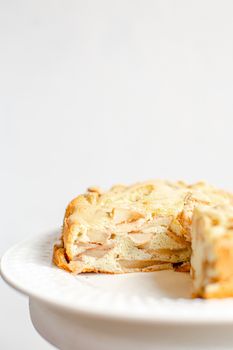 Homemade Organic Apple Pie Dessert Charlotte. Cobbler Apple Pie on White Plate and white background