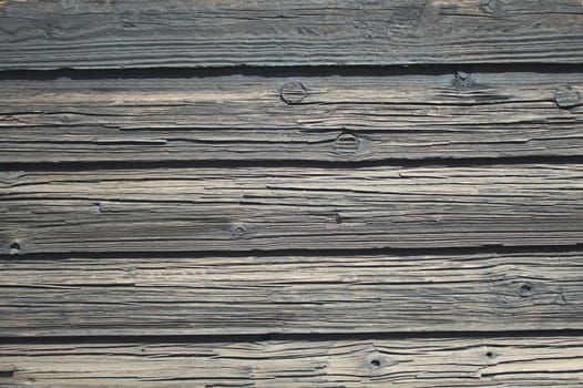 The picture shows a background with grey wooden boards
