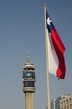 Entel Tower and flag of Chile in the Libertador Bernardo O'Higgins Avenue. Santiago de Chile. Chile.