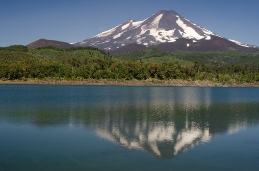 Llaima volcano reflected on the Conguillio lake. Conguillio National Park. Araucania Region. Chile.