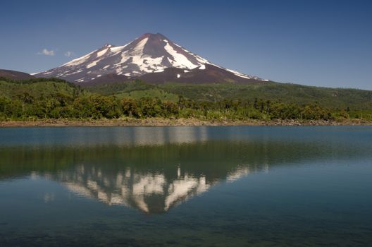 Llaima volcano reflected on the Conguillio lake. Conguillio National Park. Araucania Region. Chile.