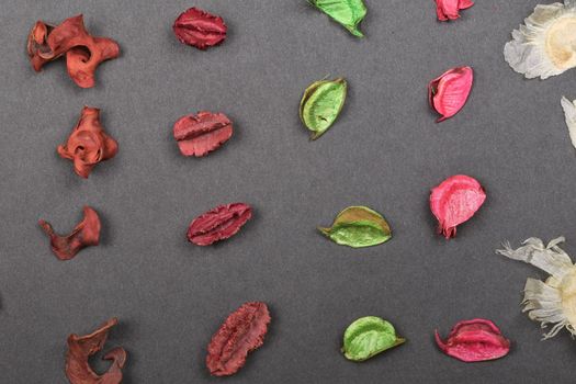 Dry petals of a potpourri laid out in the geometric form - raws. Dry flower petals