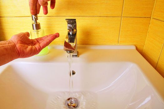 Man washing hands to prevent corona virus, hygiene to stop spreading coronavirus