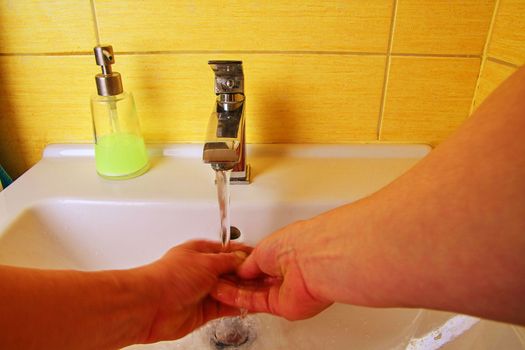 Man washing hands to prevent corona virus, hygiene to stop spreading coronavirus