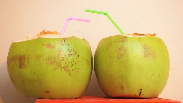 a pair of coconuts ready to be drunk
