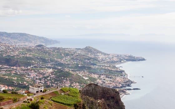 The view looking towards Funchal from Cabo Girao viewpoint on the Portuguese island of Madeira.