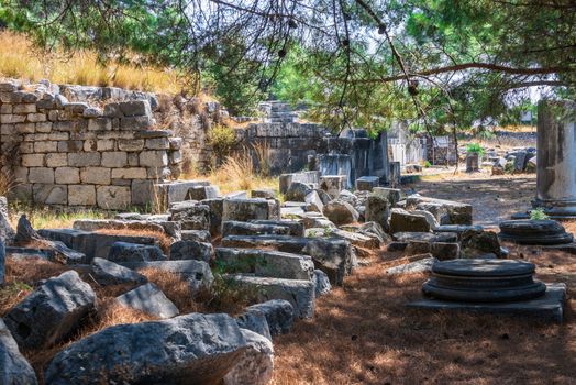 Ruins of the Ancient Theatre in the greek city of Priene in Turkey on a sunny summer day