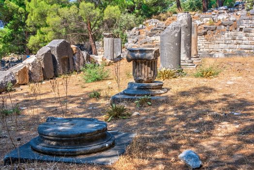 Ruins of the Ancient Theatre in the greek city of Priene in Turkey on a sunny summer day