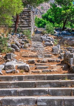 Ruins of the Ancient Theatre in the greek city of Priene in Turkey on a sunny summer day