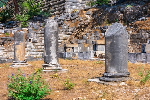 Ruins of the Ancient Theatre in the greek city of Priene in Turkey on a sunny summer day