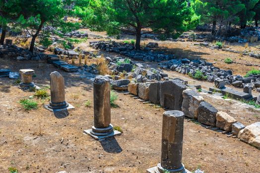 Ruins of the Ancient Theatre in the greek city of Priene in Turkey on a sunny summer day