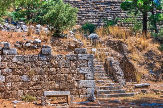 Ruins of the Ancient Theatre in the greek city of Priene in Turkey on a sunny summer day