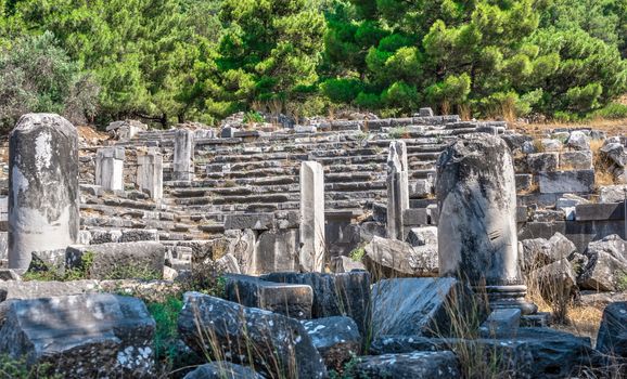 Ruins of the Ancient Theatre in the greek city of Priene in Turkey on a sunny summer day