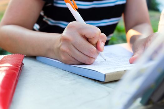 Close up female hands of accountant with calculator and pen. business accounting background.