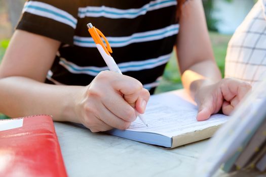 Close up female hands of accountant with calculator and pen. business accounting background.