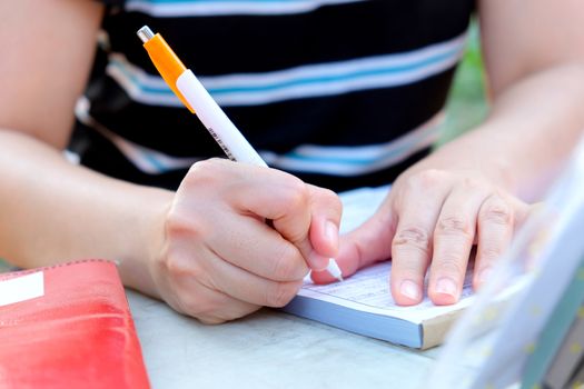 Close up female hands of accountant with calculator and pen. business accounting background.