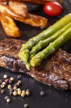 green asparagus on a steak