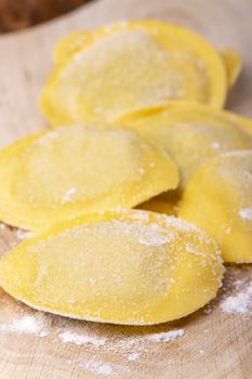 raw italian tortelli pasta with flour