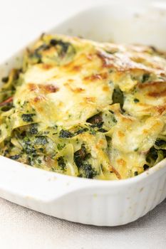 baked pasta with spinach in a casserole