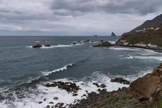 View to waves and cliff near Roque de Las Bodegas beach in the area of Taganana, Tenerife Island,  Spain