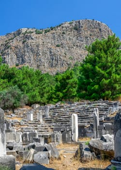 Ruins of the Bouleuterion or council house in the ancient city of Priene, Turkey, on a sunny summer day.