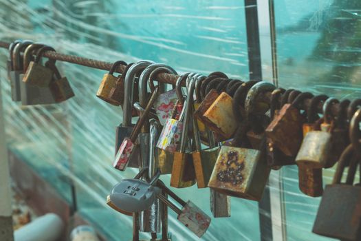 The key lock by lover couple at Noen Nangphaya View Point , Chanthaburi, Thailand, belief that prayer is complete, Concept Faith in a stable love