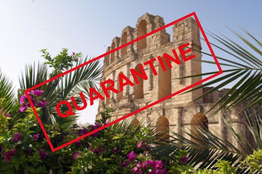 Text of the quarantine against the background of the colosseum in Tunisia, tourist attractions are closed due to a new outbreak of coronavirus. The concept of the collapse of the tourism industry.