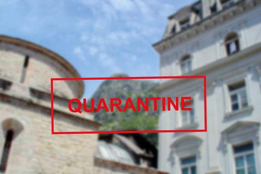 Text Quarantine against the background of medieval architecture in Montenegro . The concept of a high probability of a new coronavirus outbreak in traveling tourists