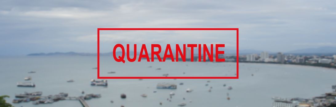 Text warning about quarantine against the background of a Bay view in Pattaya, Thailand. The concept of the collapse of the tourism industry. The sea coast is closed to tourists for quarantine