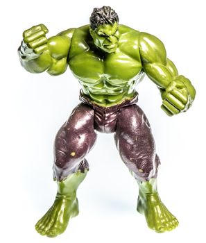 Action figure of a muscular angry green man, small toy