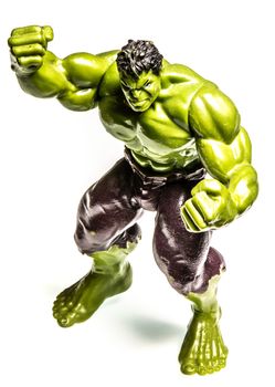 Action figure of a muscular angry green man, small toy