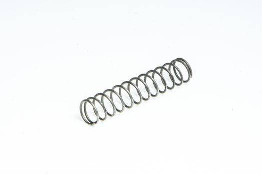 Detail of a small metal spring on a white background