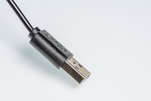 detail of a standard black usb connector on a white background