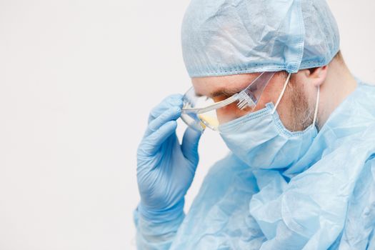 Close up of doctor. Medical equipment. A doctor wearing personal protective equipment including mask, goggle, and suit to protect COVID 19 coronavirus infection.