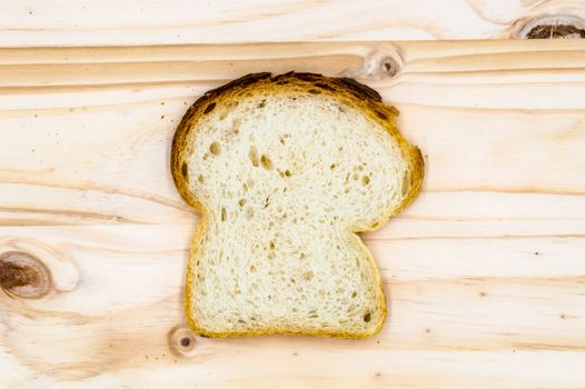 Slice of homemade bread on a wooden board