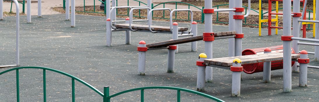 An empty modern Playground with climbing ladders on a bright Sunny spring day. An ideal place for children's outdoor activities.