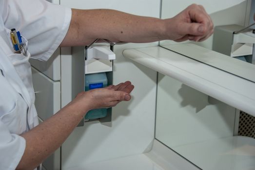 Hand hygiene for corona covid-19 and other virus prevention - proper measures to keep clean hands with alcohol gel  sanitiser on panoramic background.
