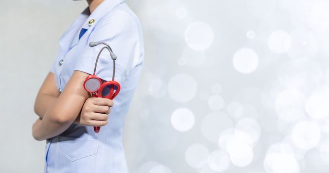 Female doctor with tools, white background