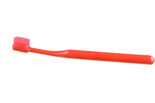 Red toothbrush isolated on the white background