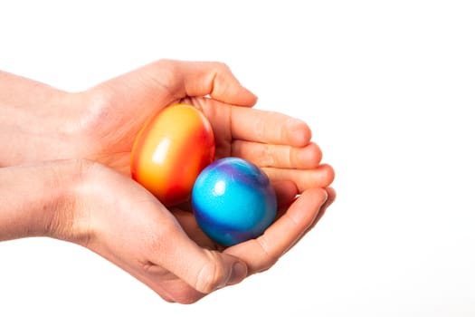 colored eggs with hands tapping and crushing eggs with copy space