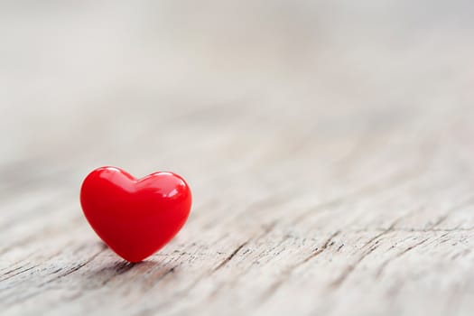 Valentines Day concept -  Red hearts on plank wooden background with copy space
