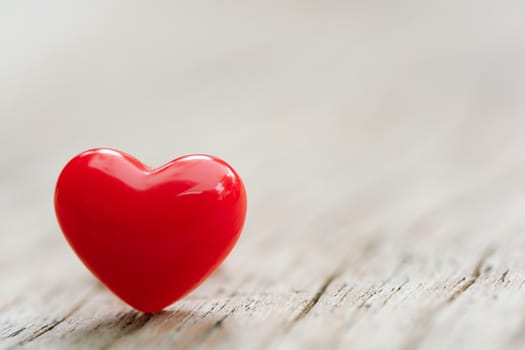 Valentines Day concept -  Red hearts on plank wooden background with copy space
