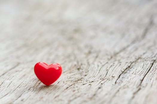 Valentines Day concept -  Red hearts on plank wooden background with copy space
