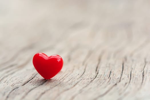 Valentines Day concept -  Red hearts on plank wooden background with copy space
