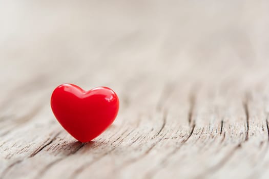 Valentines Day concept -  Red hearts on plank wooden background with copy space
